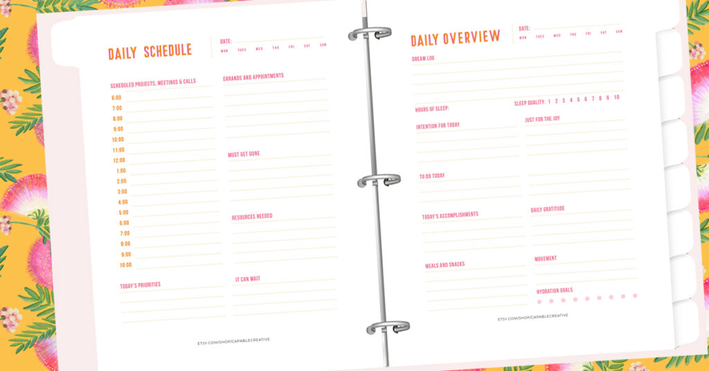 creative business planning. a binder with daily planning pages is open on a bright floral background