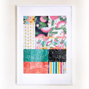 image shows a piece of patchwork fabric in a large white frame. 