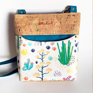image shows a cactus themed purse created with Spoonflower fabric by the yard.