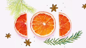 image shows dried orange slices as nature inspired art along with illustrations of rosemary, pine, and star anise.