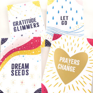 image shows four printable handmade envelopes with the words "dream seeds," "gratitude glimmers," "let go" and "prayers for change."
