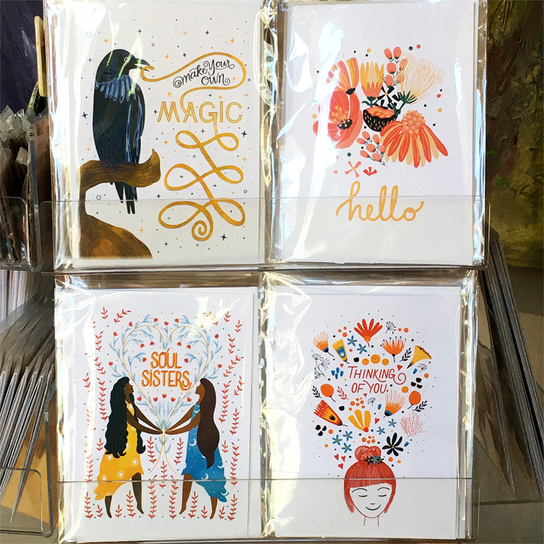 Image shows a display of greeting cards at Juniper Sky Fine Art Gallery.