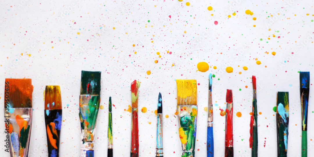 image shows a line up of paint brushes with paint splatters to demonstrate mark making tools. 