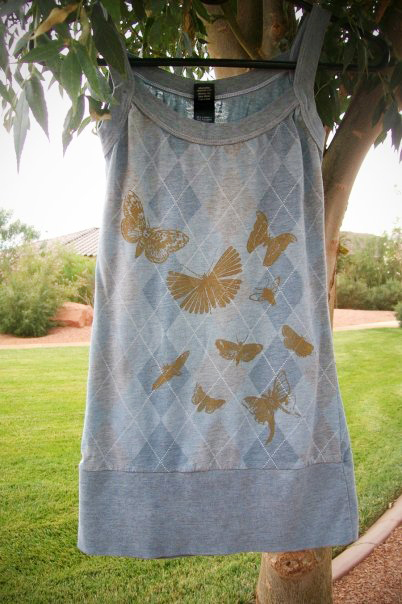 image of artist made blue argyle tank top with screen print of gold moths. Creating your own products is as easy as printing your art on clothing.