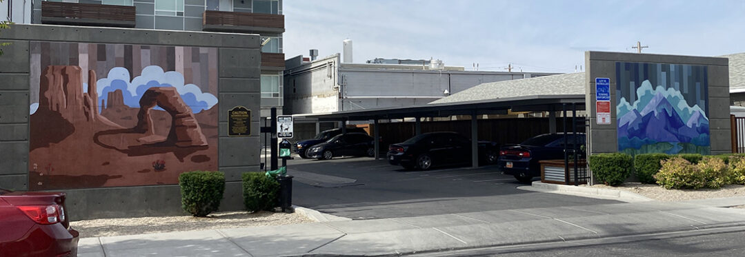 Salt Lake City parking structure adorned with two Salt Lake City murals.