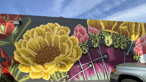 Salt Lake City mural on 2100 South featuring large beautiful cactus flowers.