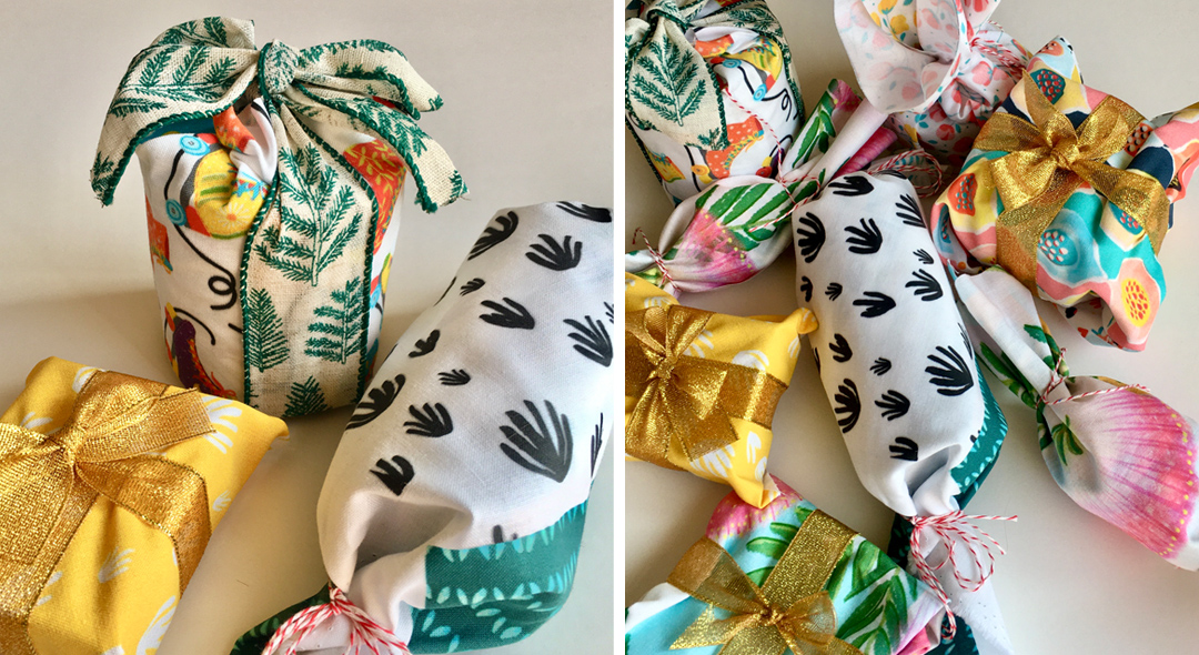 image shows gifts wrapped in fabric trendy wrapping paper.